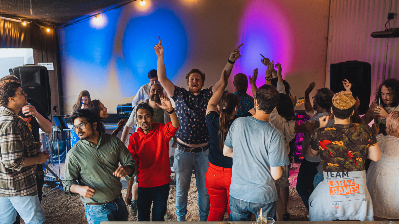 A large group of people dancing together